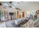 Bright living room with vaulted ceilings and a view into the kitchen area at 9103 E Winchcomb Dr, Scottsdale, AZ 85260