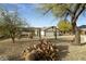 Ranch style home with two-car garage and desert landscaping at 9546 E Anasazi Pl, Gold Canyon, AZ 85118