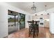 Kitchen with tile floors, white cabinets, and a view to the patio at 9546 E Anasazi Pl, Gold Canyon, AZ 85118