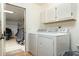 Bright laundry room with washer, dryer and garage access at 9546 E Anasazi Pl, Gold Canyon, AZ 85118