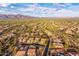 Panoramic aerial view of homes nestled amidst desert landscape with mountain views at 9900 E Desert Trail Ln, Gold Canyon, AZ 85118