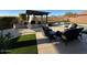 Spacious backyard with outdoor seating, a pool, fireplace and covered patio for outdoor entertaining at 9900 E Desert Trail Ln, Gold Canyon, AZ 85118