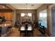 Formal dining room with a wood table, decorative chandelier, and bright natural light at 9900 E Desert Trail Ln, Gold Canyon, AZ 85118