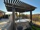 Outdoor kitchen with an eating bar, grill, and fireplace, perfect for outdoor entertaining at 9900 E Desert Trail Ln, Gold Canyon, AZ 85118