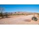 Rustic desert road with unique cattle guard and scenic mountain backdrop at 9900 E Desert Trail Ln, Gold Canyon, AZ 85118