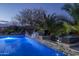 Relaxing backyard pool with a waterfall and a wooden bridge at 10 E Old Paint Trl, Phoenix, AZ 85086