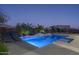 Inviting backyard pool with a waterfall feature and lounge chairs at 10 E Old Paint Trl, Phoenix, AZ 85086