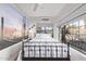 Bedroom with a metal bed frame and window seating at 1002 E Palm Ln, Phoenix, AZ 85006
