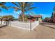 Charming bungalow with a white picket fence and beautiful landscaping at 1002 E Palm Ln, Phoenix, AZ 85006