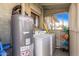 Exterior laundry room with washer, dryer, and water heater at 1002 E Palm Ln, Phoenix, AZ 85006