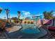 Inviting kidney-shaped pool with patio and colorful mural at 1002 E Palm Ln, Phoenix, AZ 85006