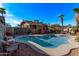 Charming backyard oasis featuring a kidney-shaped pool and patio furniture at 1002 E Palm Ln, Phoenix, AZ 85006