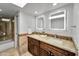 Light and bright bathroom offering dual sinks, granite counters, and updated fixtures at 10546 E Topaz Cir, Scottsdale, AZ 85258