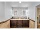 Modern bathroom with dual sinks, granite counters, and updated fixtures at 10546 E Topaz Cir, Scottsdale, AZ 85258