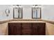 Double vanity bathroom with granite countertop and dark wood cabinets at 10546 E Topaz Cir, Scottsdale, AZ 85258