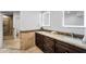 Bathroom features dual sinks with granite counters and modern, framed mirrors at 10546 E Topaz Cir, Scottsdale, AZ 85258