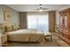 Spacious bedroom with a large bed and antique wooden armoire at 10546 E Topaz Cir, Scottsdale, AZ 85258