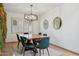 Dining room with wood table and green chairs at 10546 E Topaz Cir, Scottsdale, AZ 85258