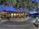 Attractive home exterior with landscaping at night at 10546 E Topaz Cir, Scottsdale, AZ 85258