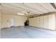 Attached garage with built-in storage cabinets at 10546 E Topaz Cir, Scottsdale, AZ 85258