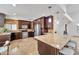 Spacious kitchen featuring custom cabinets, stainless steel appliances, and a breakfast bar at 10546 E Topaz Cir, Scottsdale, AZ 85258
