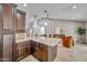Gourmet kitchen with a center island and a seamless transition to the inviting living area at 10546 E Topaz Cir, Scottsdale, AZ 85258