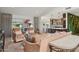 Living room with couches and view into kitchen at 10546 E Topaz Cir, Scottsdale, AZ 85258