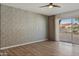 Bright living room with wood flooring and sliding glass doors at 10546 E Topaz Cir, Scottsdale, AZ 85258