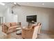 Living room with couches and a TV at 10546 E Topaz Cir, Scottsdale, AZ 85258