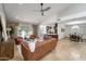 Open-concept living space featuring a vaulted ceiling and a seamless transition to the dining and kitchen areas at 10546 E Topaz Cir, Scottsdale, AZ 85258