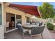 Covered patio with seating area and retractable awning at 10546 E Topaz Cir, Scottsdale, AZ 85258