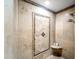 Custom shower with tile detail, rain shower head, and built in soap shelf at 10546 E Topaz Cir, Scottsdale, AZ 85258