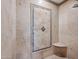 Elegant shower with a tiled accent wall and built-in seat at 10546 E Topaz Cir, Scottsdale, AZ 85258