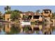 Lakefront property with boat and beautiful reflection at 10546 E Topaz Cir, Scottsdale, AZ 85258