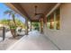 Covered patio with ceiling fan, outdoor seating, and views of the backyard at 1078 W Spur Ct, Gilbert, AZ 85233