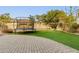 Artificial turf, trampoline, and playset in backyard at 1078 W Spur Ct, Gilbert, AZ 85233