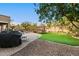 Artificial turf, grill, and play area in backyard at 1078 W Spur Ct, Gilbert, AZ 85233