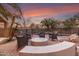 Patio with fire pit and seating area near the pool at 1078 W Spur Ct, Gilbert, AZ 85233