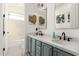 Stylish bathroom with double vanity, black fixtures, and a view of the tub at 1078 W Spur Ct, Gilbert, AZ 85233