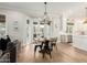 Bright breakfast nook with a round table and chairs, hardwood floors and French doors at 1078 W Spur Ct, Gilbert, AZ 85233