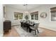 Elegant dining room featuring a rustic wood table and modern metal chairs at 1078 W Spur Ct, Gilbert, AZ 85233