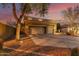 Two-story house with a three-car garage and front walkway at 1078 W Spur Ct, Gilbert, AZ 85233