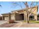 Two-story house with a three-car garage and brick walkway at 1078 W Spur Ct, Gilbert, AZ 85233