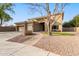 Two-story house with a three-car garage and brick walkway at 1078 W Spur Ct, Gilbert, AZ 85233