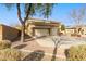 Two-story house with three-car garage and mature trees at 1078 W Spur Ct, Gilbert, AZ 85233