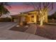 Two-story house with a three-car garage and brick walkway at 1078 W Spur Ct, Gilbert, AZ 85233