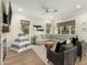 Cozy Gathering room featuring a fireplace, a ceiling fan, and comfortable seating at 1078 W Spur Ct, Gilbert, AZ 85233