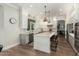 Modern kitchen with white and gray cabinets and a large island at 1078 W Spur Ct, Gilbert, AZ 85233