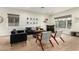 Spacious living room with hardwood floors, comfortable seating, and a home bar at 1078 W Spur Ct, Gilbert, AZ 85233