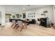Open concept living room with hardwood floors and a home bar at 1078 W Spur Ct, Gilbert, AZ 85233